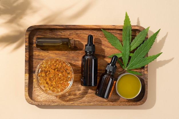 CBD oils and products on a wooden tray